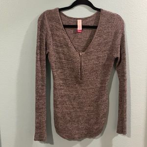 Grey tight long sleeve shirt.